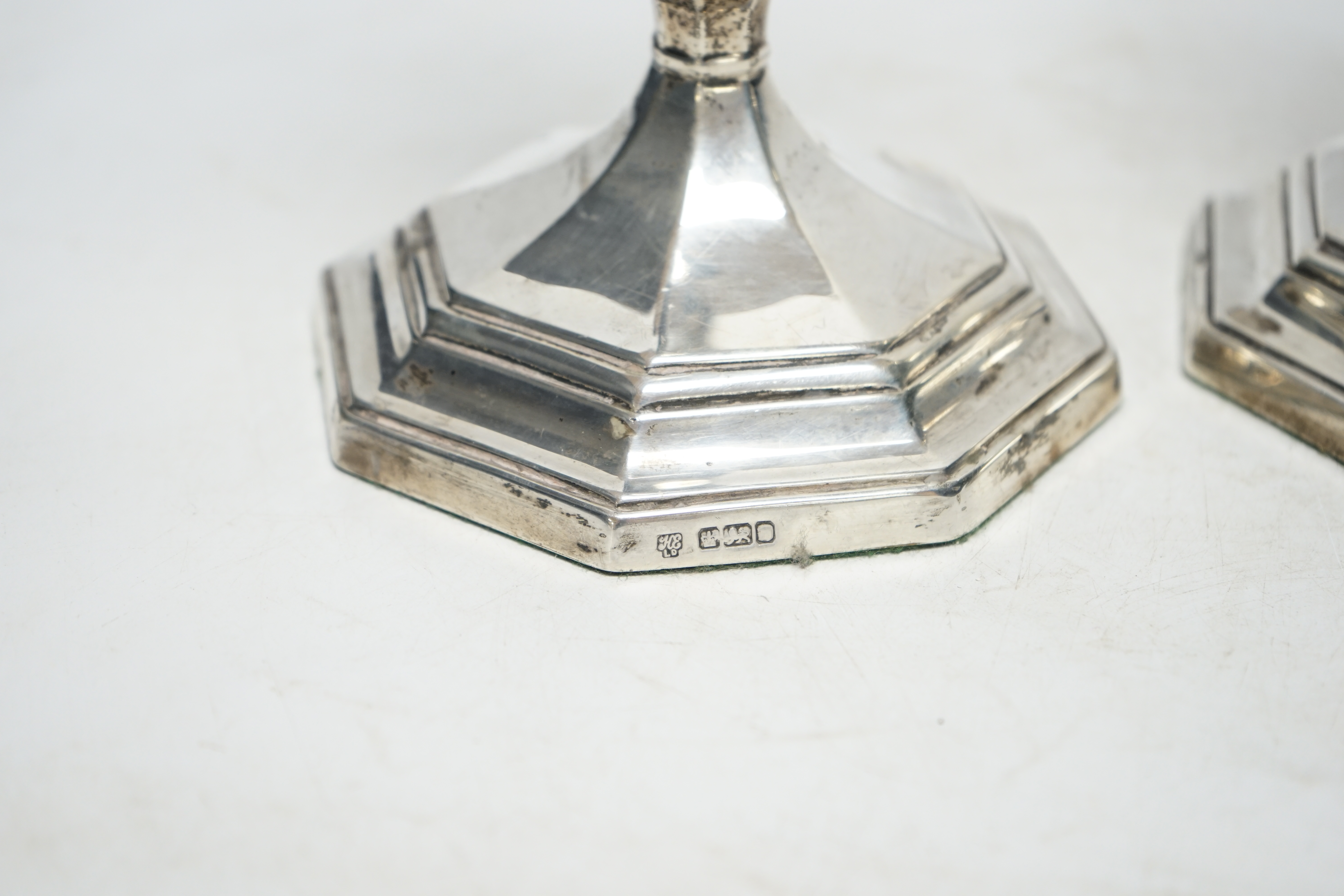 A pair of Edwardian silver octagonal candlesticks, Hawksworth, Eyre & Co Ltd, Sheffield, 1905, 21.7cm, weighted. Condition - average to fair